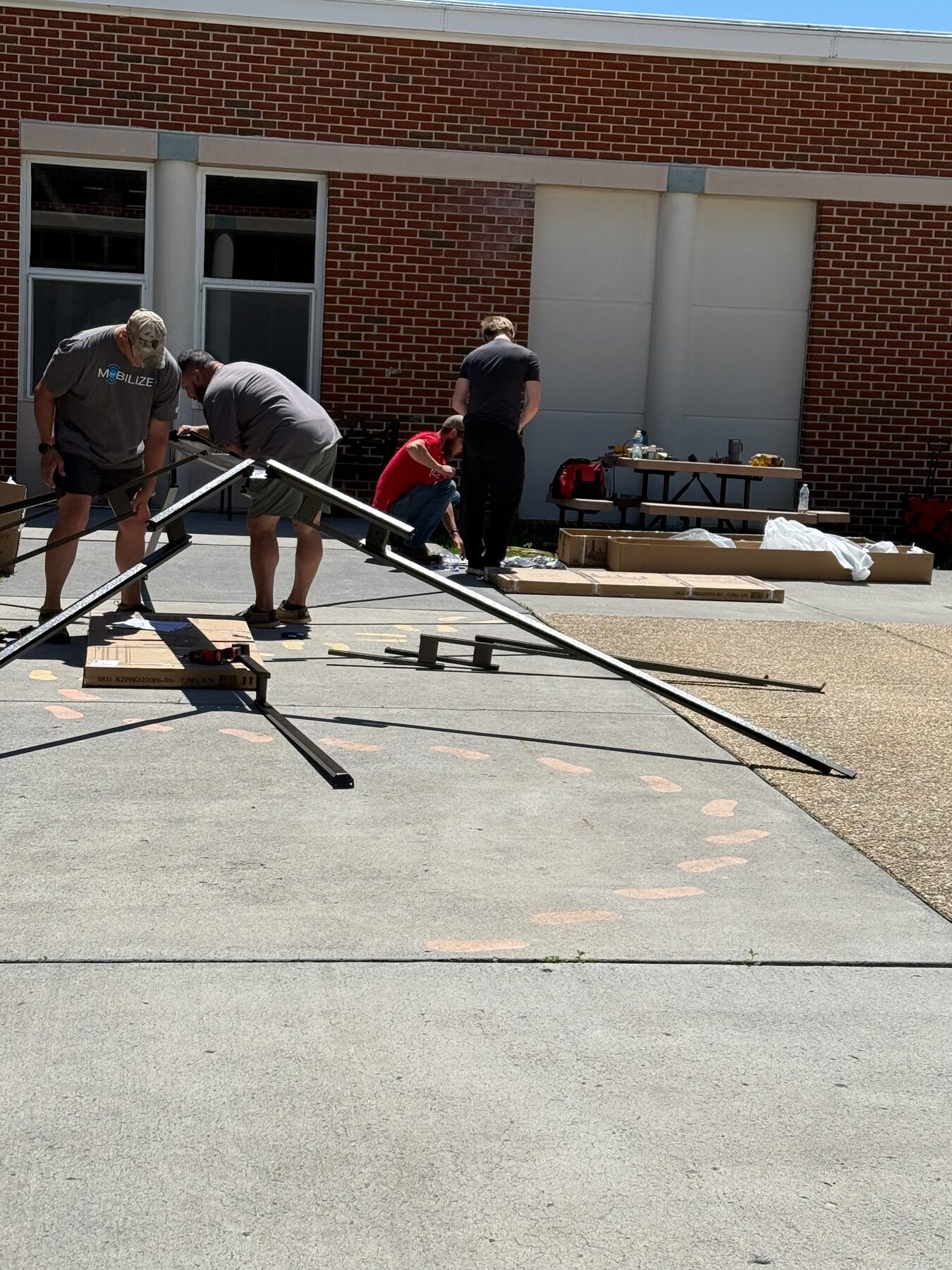 Volunteers rebuilding an outdoor area at a local school